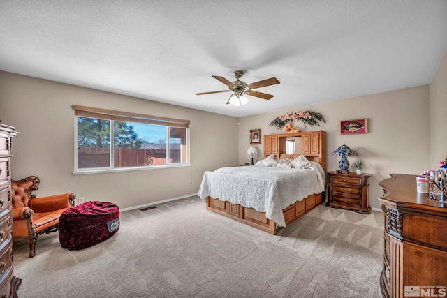 5620 Tassel Dr, Sun Valley, NV 89433 - bedroom featuring light carpet, baseboards, and ceiling fan