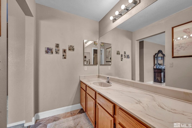 5620 Tassel Dr, Sun Valley, NV 89433 - bathroom with vanity, baseboards, and tile patterned floors
