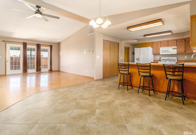 5925 Arvilla Ln, Fallon, NV 89406 - kitchen featuring white appliances, a chandelier, a ceiling fan, light tile patterned flooring, and light countertops
