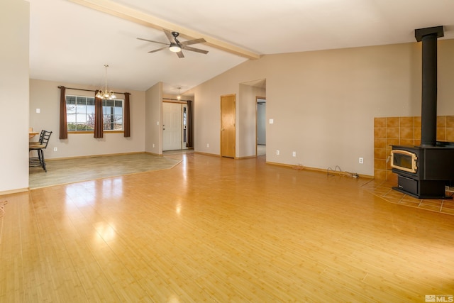 5925 Arvilla Ln, Fallon, NV 89406 - unfurnished living room featuring a wood stove, a ceiling fan, wood finished floors, and baseboards