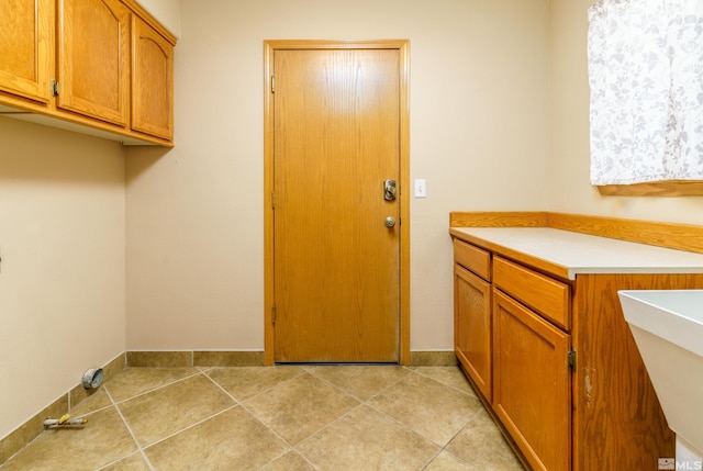 5925 Arvilla Ln, Fallon, NV 89406 - laundry area with baseboards and light tile patterned floors