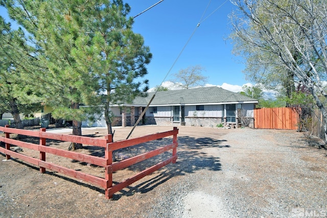 916 Tillman Ln, Gardnerville, NV 89460 - view of front facade featuring gravel driveway, a fenced front yard, and roof with shingles