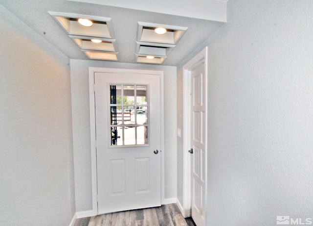 916 Tillman Ln, Gardnerville, NV 89460 - doorway featuring baseboards and wood finished floors