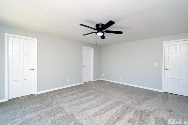 916 Tillman Ln, Gardnerville, NV 89460 - unfurnished room with ceiling fan, carpet, baseboards, and a textured ceiling