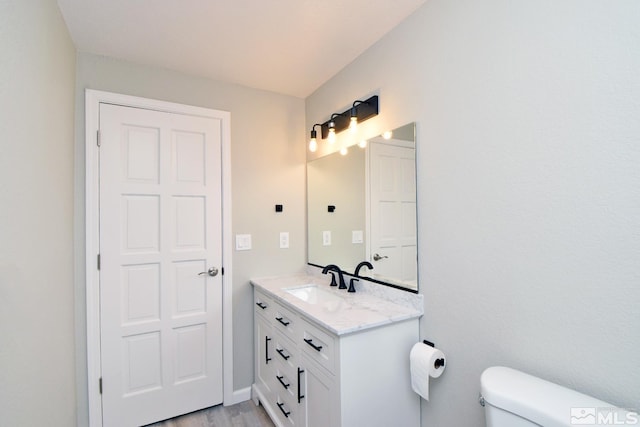 916 Tillman Ln, Gardnerville, NV 89460 - half bath with toilet, vanity, and wood finished floors