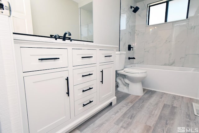 916 Tillman Ln, Gardnerville, NV 89460 - full bath with shower / bath combination, toilet, wood finished floors, and vanity