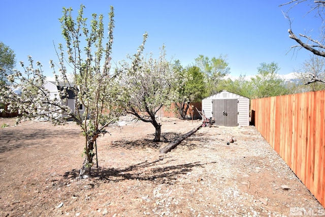 916 Tillman Ln, Gardnerville, NV 89460 - fenced backyard featuring a shed and an outbuilding