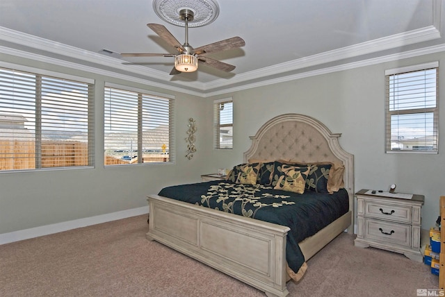 bedroom featuring light carpet, crown molding, baseboards, and ceiling fan