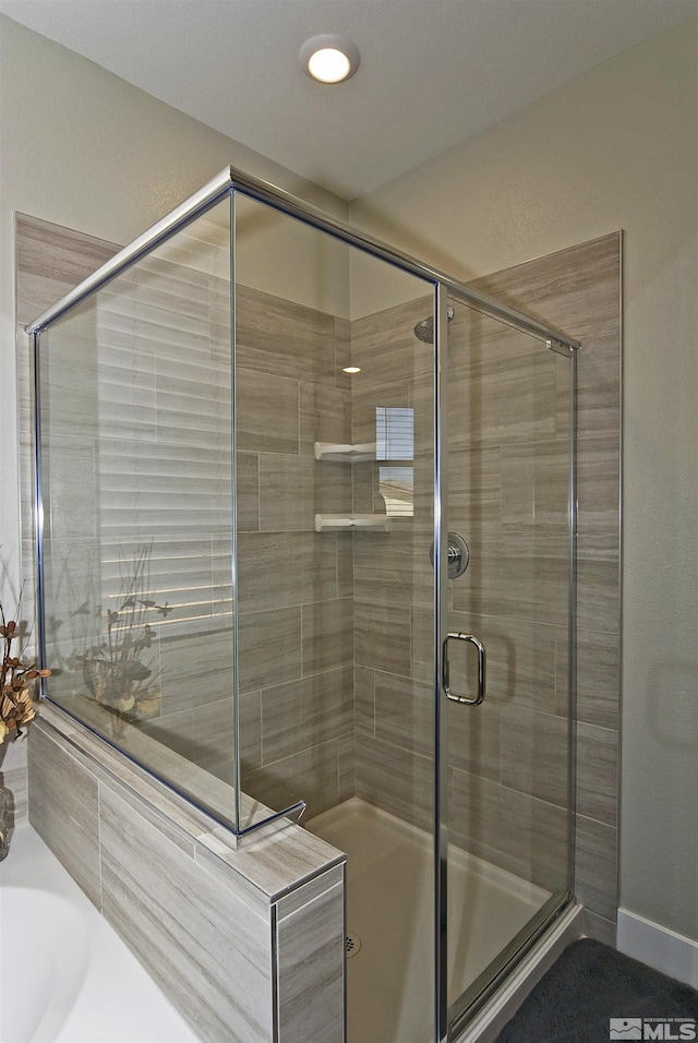 full bathroom with a stall shower