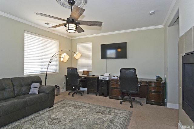 carpeted office space featuring crown molding and ceiling fan