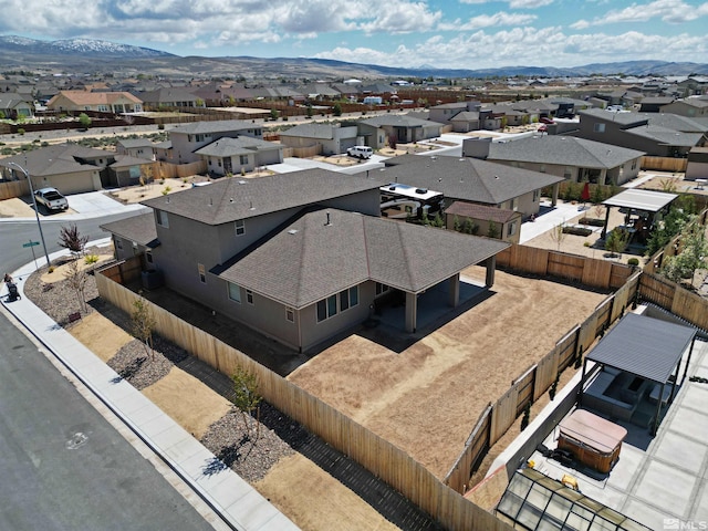 aerial perspective of suburban area featuring a mountainous background