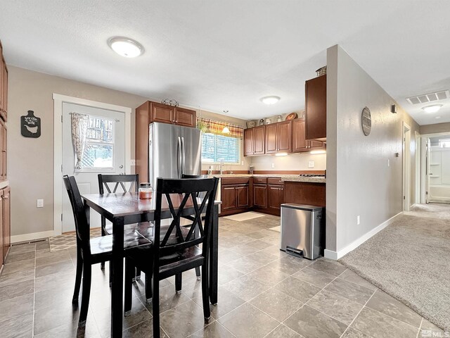 574 W National Ave, Winnemucca, NV 89445 - dining space with baseboards