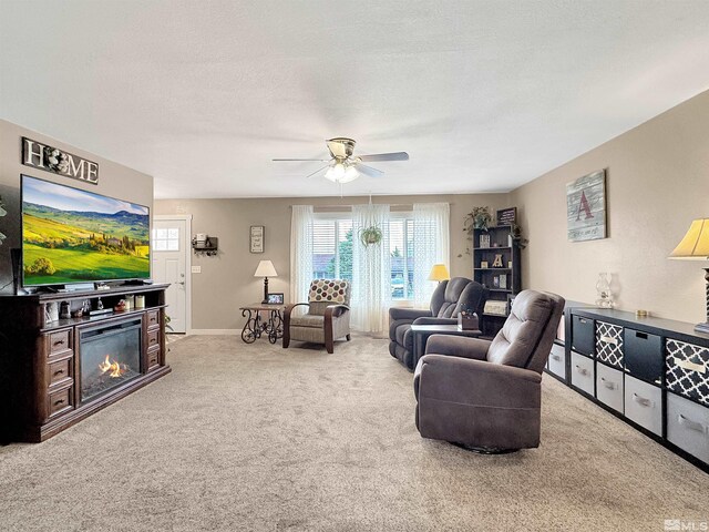 574 W National Ave, Winnemucca, NV 89445 - carpeted living room featuring a ceiling fan and baseboards