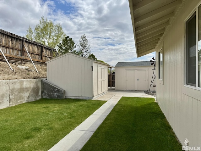 574 W National Ave, Winnemucca, NV 89445 - view of yard featuring a storage shed, an outdoor structure, and a patio area