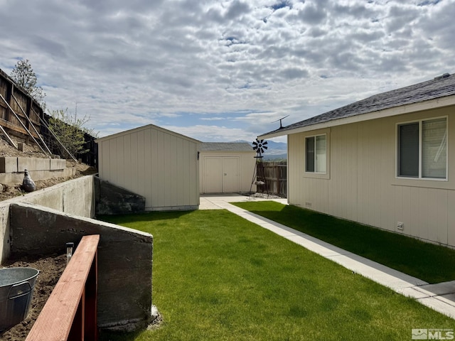 574 W National Ave, Winnemucca, NV 89445 - view of yard with a storage unit and an outbuilding
