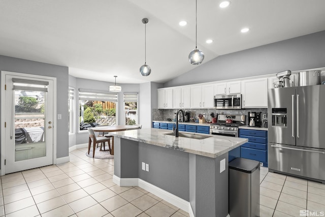 2445 Libero, Sparks, NV 89436 - kitchen with appliances with stainless steel finishes, a sink, white cabinetry, backsplash, and blue cabinets