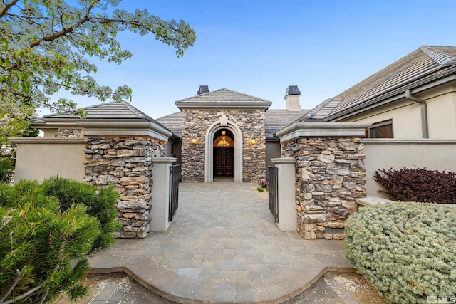 12360 High Vista Dr, Reno, NV 89511 - view of exterior entry with stone siding and stucco siding