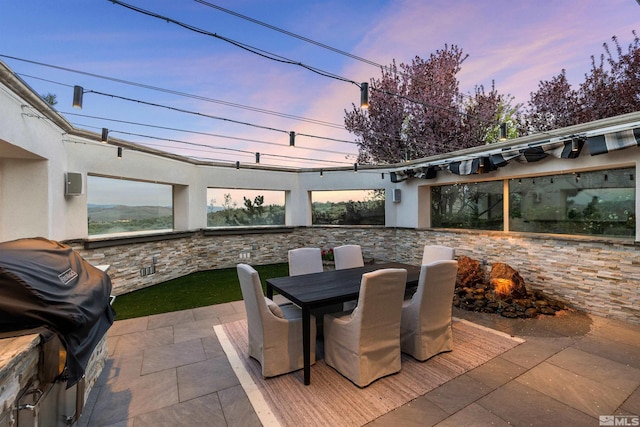 12360 High Vista Dr, Reno, NV 89511 - patio terrace at dusk with outdoor dining area