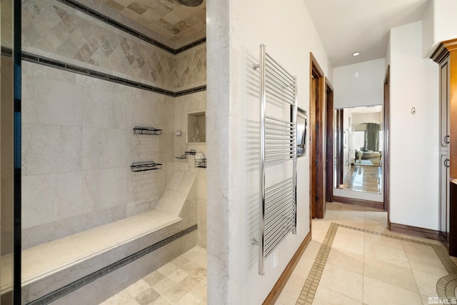 12360 High Vista Dr, Reno, NV 89511 - full bath featuring a tile shower, a towel warming rack, inlaid floor details, tile patterned flooring, and recessed lighting