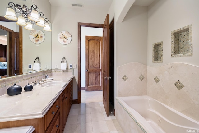 12360 High Vista Dr, Reno, NV 89511 - bathroom with a bath, vanity, tile patterned floors, and backsplash