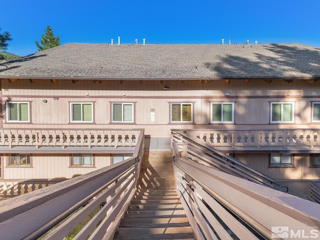 261 Quaking Aspen Ln Unit 8, Stateline, NV 89449 - rear view of property with roof with shingles