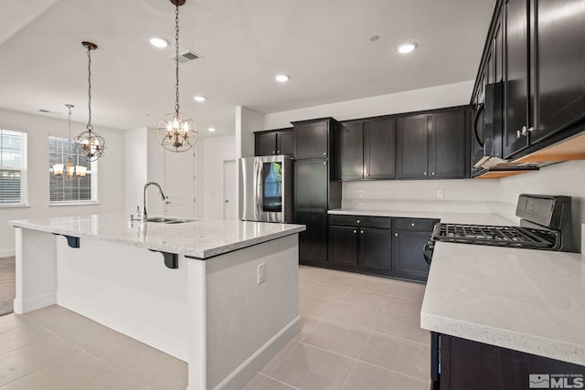 1987 Wind Ranch Rd Unit C, Reno, NV 89521 - kitchen with smart refrigerator, a sink, gas stove, black microwave, and a chandelier