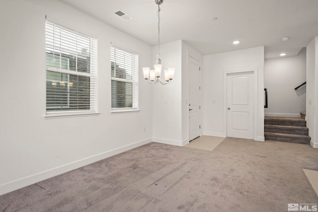 1987 Wind Ranch Rd Unit C, Reno, NV 89521 - unfurnished dining area with a chandelier, stairs, carpet floors, baseboards, and recessed lighting