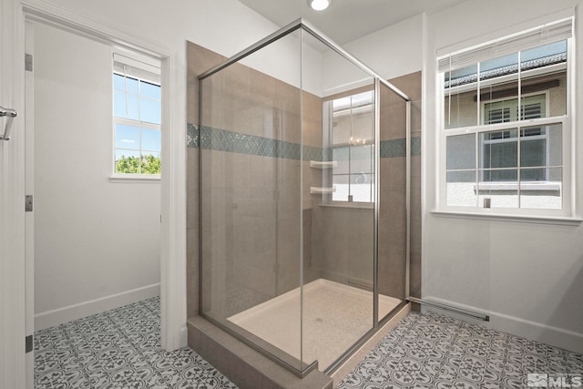 1987 Wind Ranch Rd Unit C, Reno, NV 89521 - full bath with healthy amount of natural light, baseboards, a stall shower, and tile patterned flooring