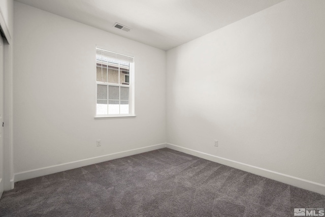 1987 Wind Ranch Rd Unit C, Reno, NV 89521 - spare room with dark colored carpet and baseboards