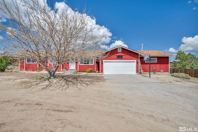10205 Shenandoah Dr, Reno, NV 89508 - ranch-style home with dirt driveway, fence, and an attached garage