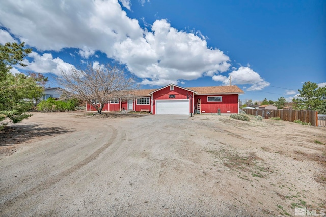 10205 Shenandoah Dr, Reno, NV 89508 - ranch-style home with a garage, fence, and dirt driveway