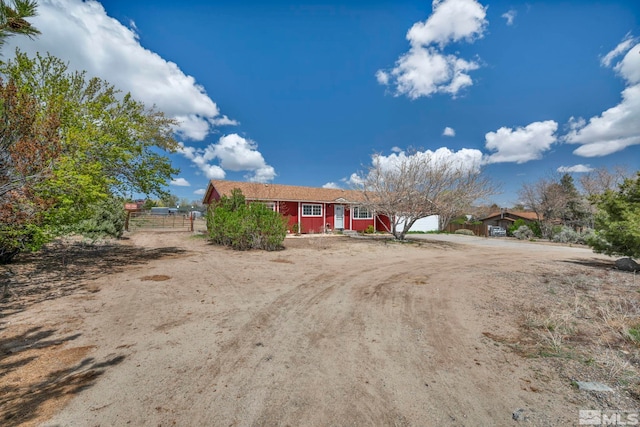 10205 Shenandoah Dr, Reno, NV 89508 - view of front of home featuring driveway, fence, and a gate