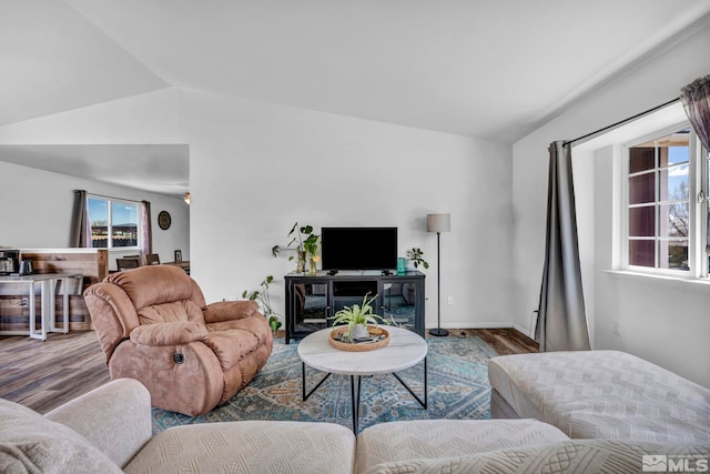 10205 Shenandoah Dr, Reno, NV 89508 - living room featuring vaulted ceiling and wood finished floors