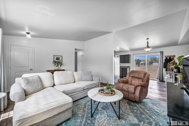 10205 Shenandoah Dr, Reno, NV 89508 - living area with wood finished floors, baseboards, and lofted ceiling