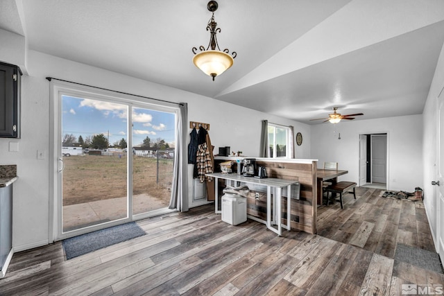 10205 Shenandoah Dr, Reno, NV 89508 - kitchen with wood finished floors, a ceiling fan, vaulted ceiling, and decorative light fixtures