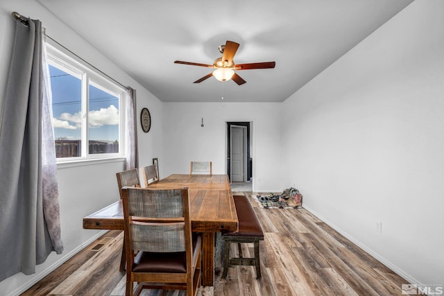 10205 Shenandoah Dr, Reno, NV 89508 - dining room featuring ceiling fan, wood finished floors, and baseboards
