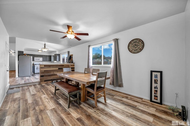 10205 Shenandoah Dr, Reno, NV 89508 - dining room with hardwood / wood-style floors, ceiling fan, lofted ceiling, and baseboards