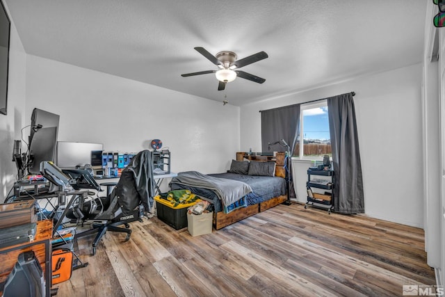 10205 Shenandoah Dr, Reno, NV 89508 - bedroom featuring wood finished floors, an office area, a ceiling fan, and a textured ceiling