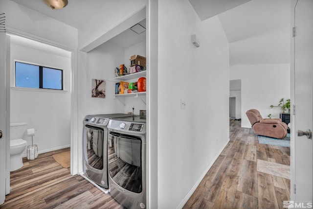 10205 Shenandoah Dr, Reno, NV 89508 - washroom featuring independent washer and dryer, wood finished floors, and baseboards