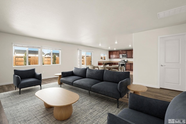 8971 Sagemoor Dr, Reno, NV 89506 - living room featuring dark wood-style flooring, baseboards, and recessed lighting