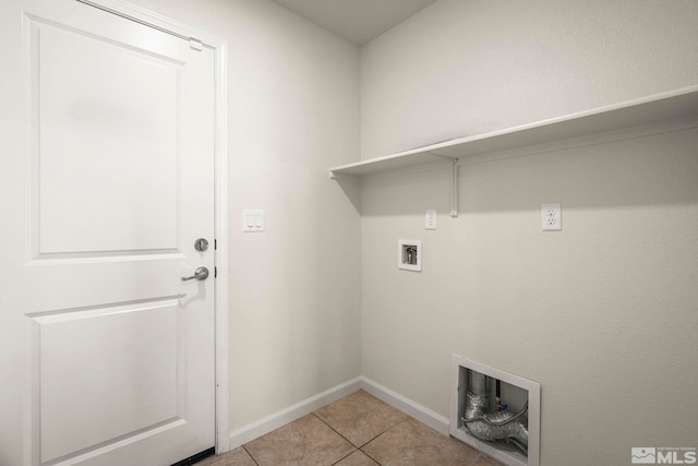 8971 Sagemoor Dr, Reno, NV 89506 - laundry room featuring washer hookup, light tile patterned floors, and baseboards