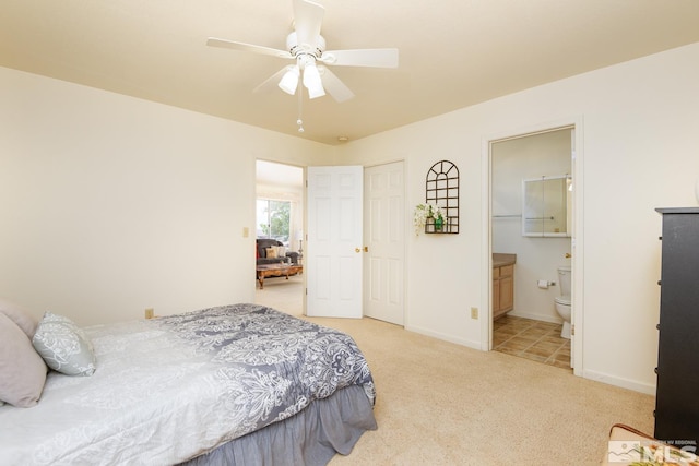 23 Upper Colony, Wellington, NV 89444 - bedroom featuring light colored carpet, baseboards, ensuite bathroom, and a ceiling fan