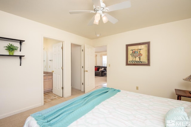 23 Upper Colony, Wellington, NV 89444 - bedroom with light colored carpet, baseboards, connected bathroom, and a ceiling fan