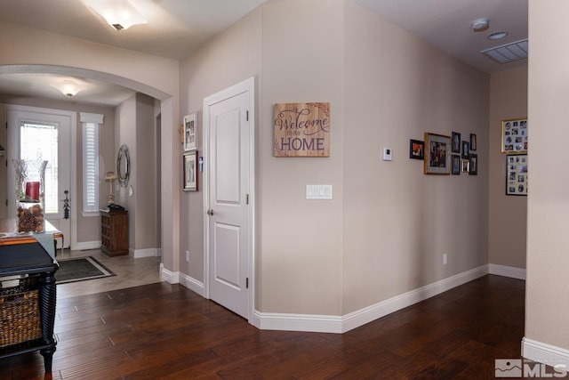1058 Aspen Brook Ln, Gardnerville, NV 89460 - entrance foyer with arched walkways, hardwood / wood-style floors, and baseboards