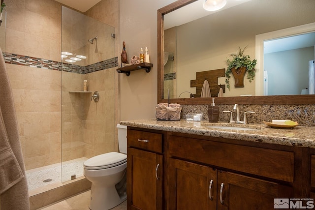 1058 Aspen Brook Ln, Gardnerville, NV 89460 - full bathroom featuring a tile shower, toilet, vanity, and tile patterned flooring