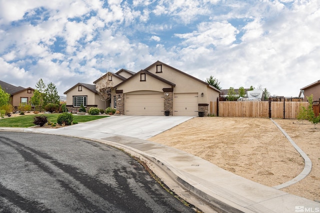 540 Clove Hitch Ct, Sparks, NV 89441 - view of front of house featuring stucco siding, fence, concrete driveway, an attached garage, and stone siding