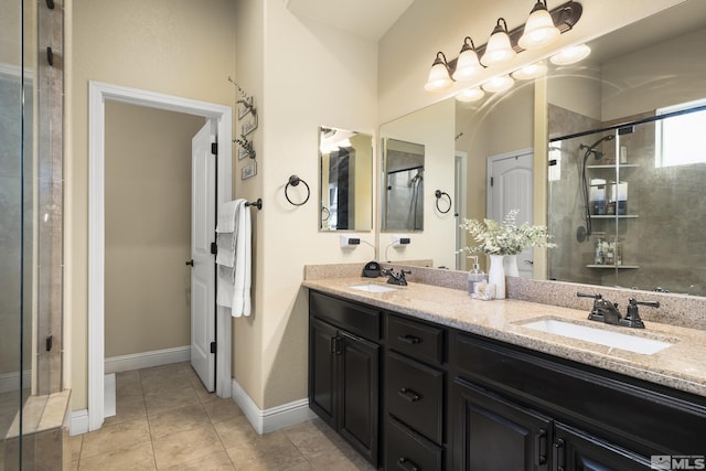 540 Clove Hitch Ct, Sparks, NV 89441 - bathroom with a shower stall, double vanity, baseboards, and tile patterned floors