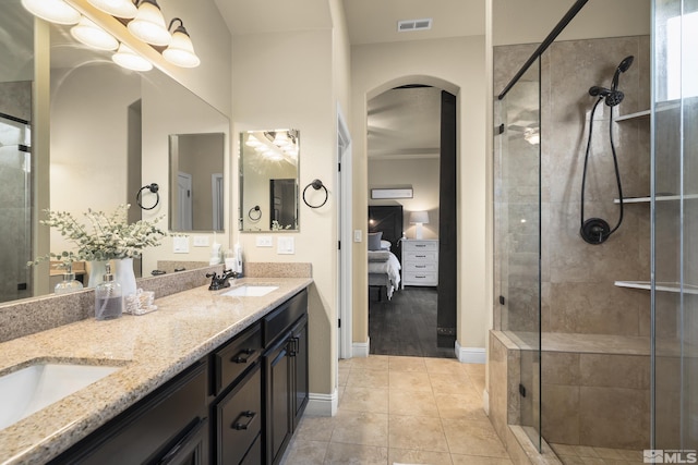 540 Clove Hitch Ct, Sparks, NV 89441 - ensuite bathroom with a stall shower, baseboards, and double vanity