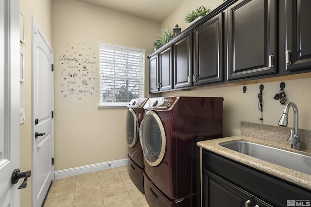 540 Clove Hitch Ct, Sparks, NV 89441 - laundry area featuring washer and dryer, cabinet space, baseboards, and light tile patterned flooring