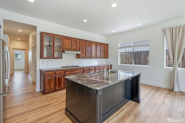 2705 Wind Feather Trl, Reno, NV 89511 - kitchen featuring a sink, gas cooktop, light wood-type flooring, freestanding refrigerator, and recessed lighting